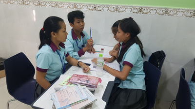 High school students having group discussion.